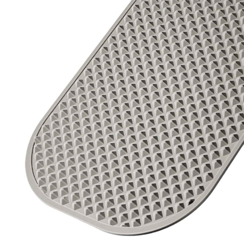 How do silicone acupressure pads maintain their stability on slippery bathroom floors?